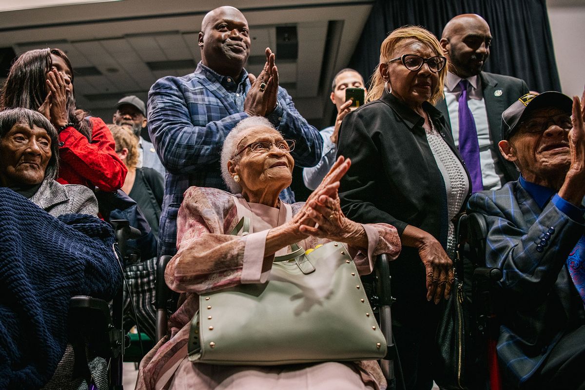 Survivors Lessie Benningfield Randle, Viola Fletcher, and Hughes Van Ellis sing together at the conclusion of a rally during commemorations of the 100th anniversary of the Tulsa Race Massacre on June 01, 2021 in Tulsa, Oklahoma. (Brandon Bell/Getty Images)