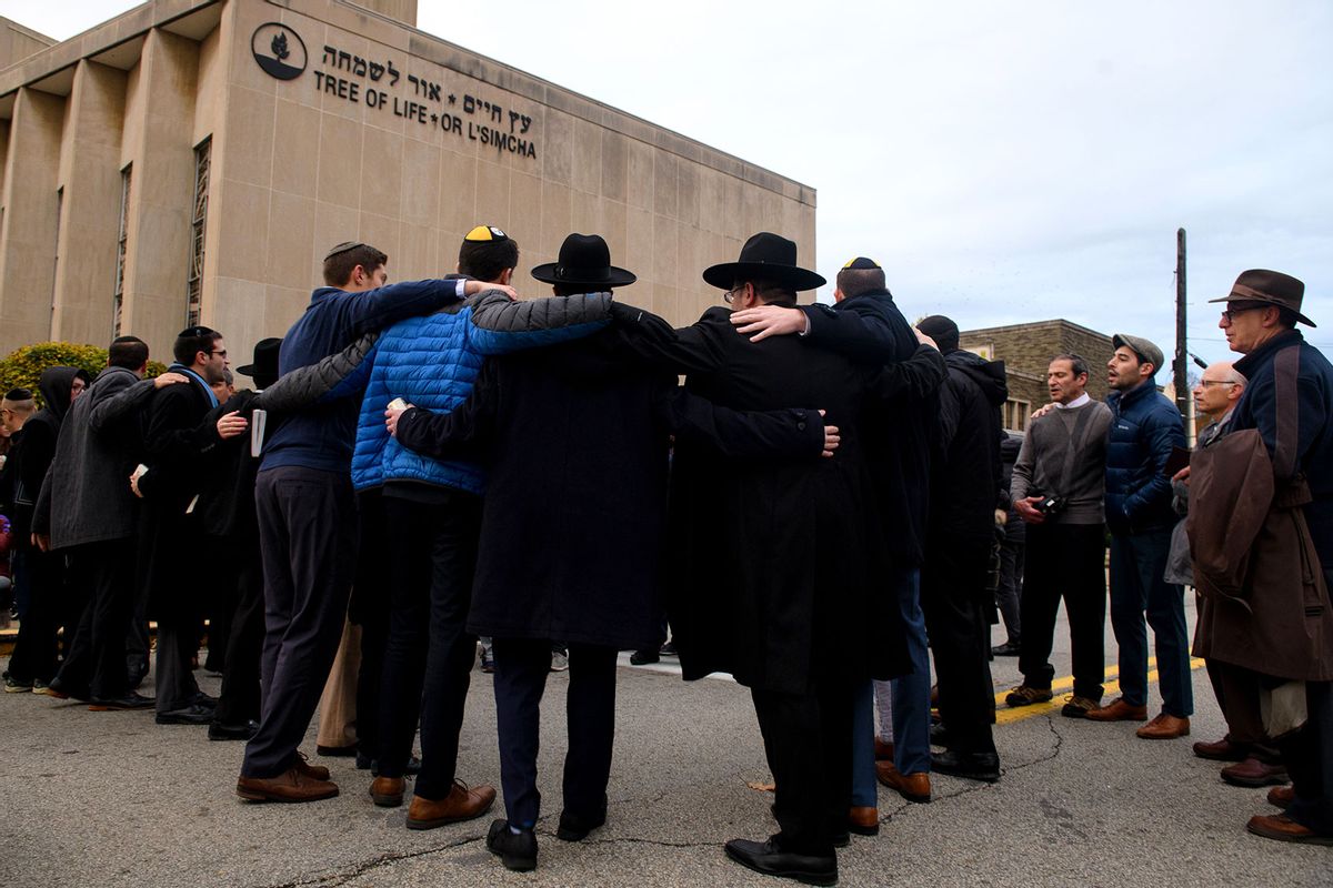 Members of the Jewish faith gather in front of the Tree of Life Synagogue for the Shabbat on Friday evening, November 2, 2018 in Pittsburgh's Squirrel Hill neighborhood. 11 people were killed in a mass shooting at the synagogue on Saturday morning, October 27, 2018. (Justin Merriman/For The Washington Post via Getty Images)