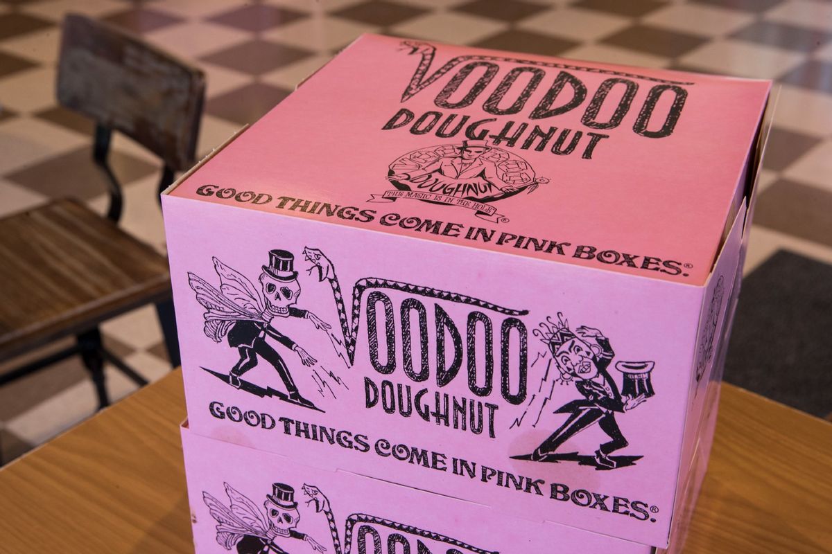 Pink doughnut boxes are shown in the dining room at Voodoo Doughnut on Tuesday, Jan. 7, 2020, in Houston.  ( Brett Coomer/Houston Chronicle via Getty Images)