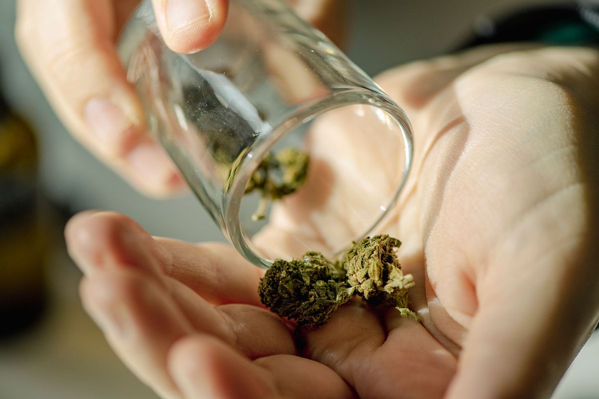 Close-up of senior woman using cannabis at home (Getty Images/Emilija Manevska)