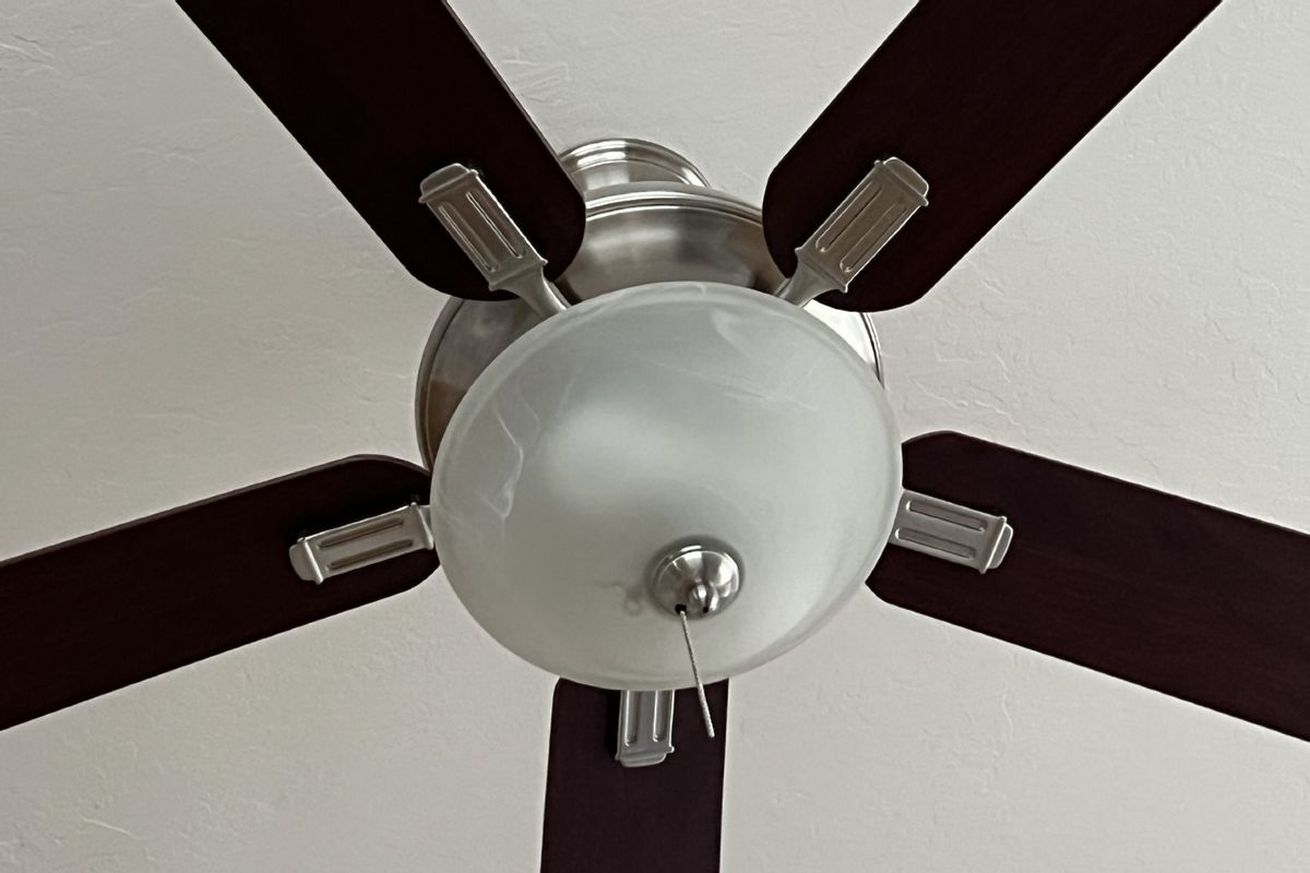 Low-angle close-up of a ceiling fan on the ceiling of a domestic home in Lafayette, California, March 24, 2022. (Photo by Gado/Getty Images)