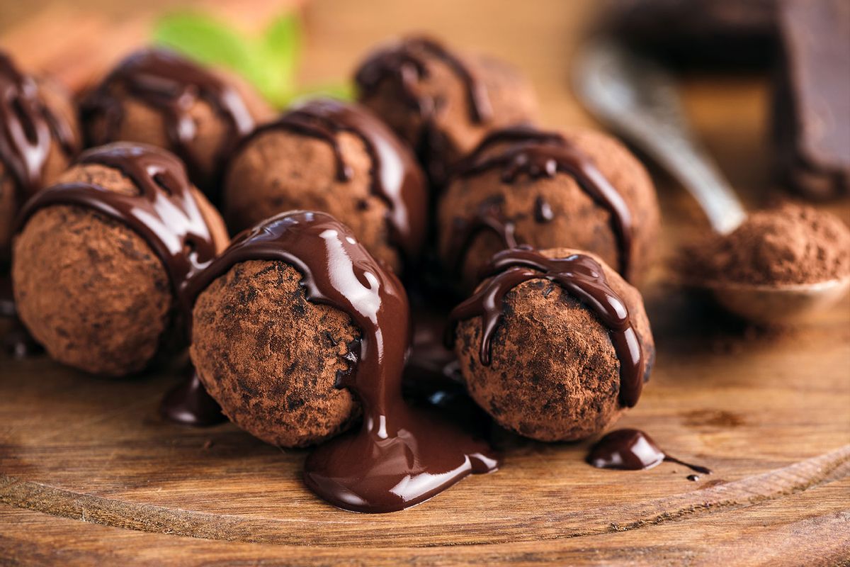 Chocolate candy truffles glazed with chocolate ganache (Getty Images/Arx0nt)