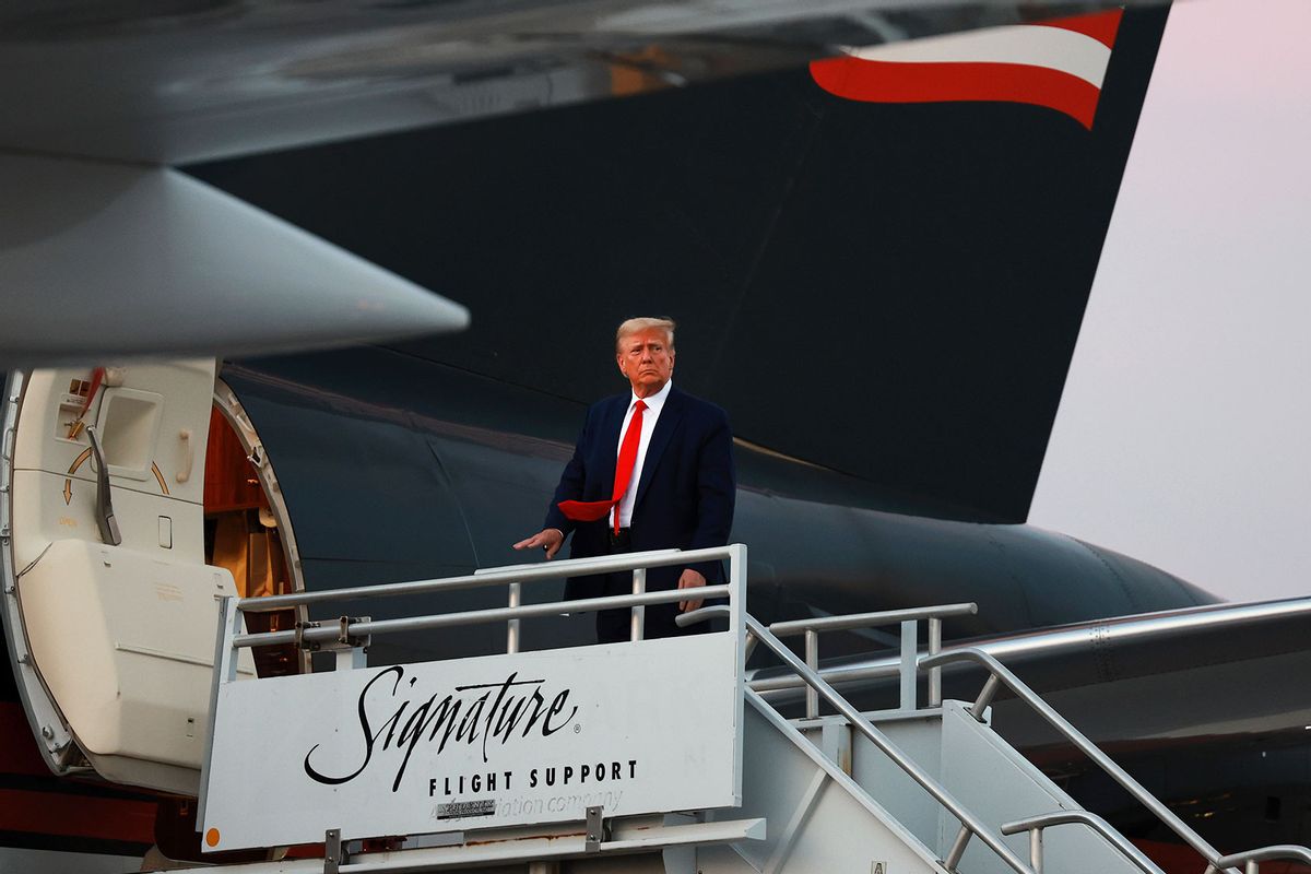 Former U.S. President Donald Trump boards his private airplane, also known as Trump Force One, as he departs Atlanta Hartsfield-Jackson International Airport after being booked at the Fulton County jail on August 24, 2023 in Atlanta, Georgia. (Joe Raedle/Getty Images)