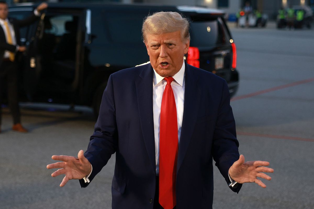 Former U.S. President Donald Trump speaks to the media at Atlanta Hartsfield-Jackson International Airport after being booked at the Fulton County jail on August 24, 2023 in Atlanta, Georgia. (Joe Raedle/Getty Images)
