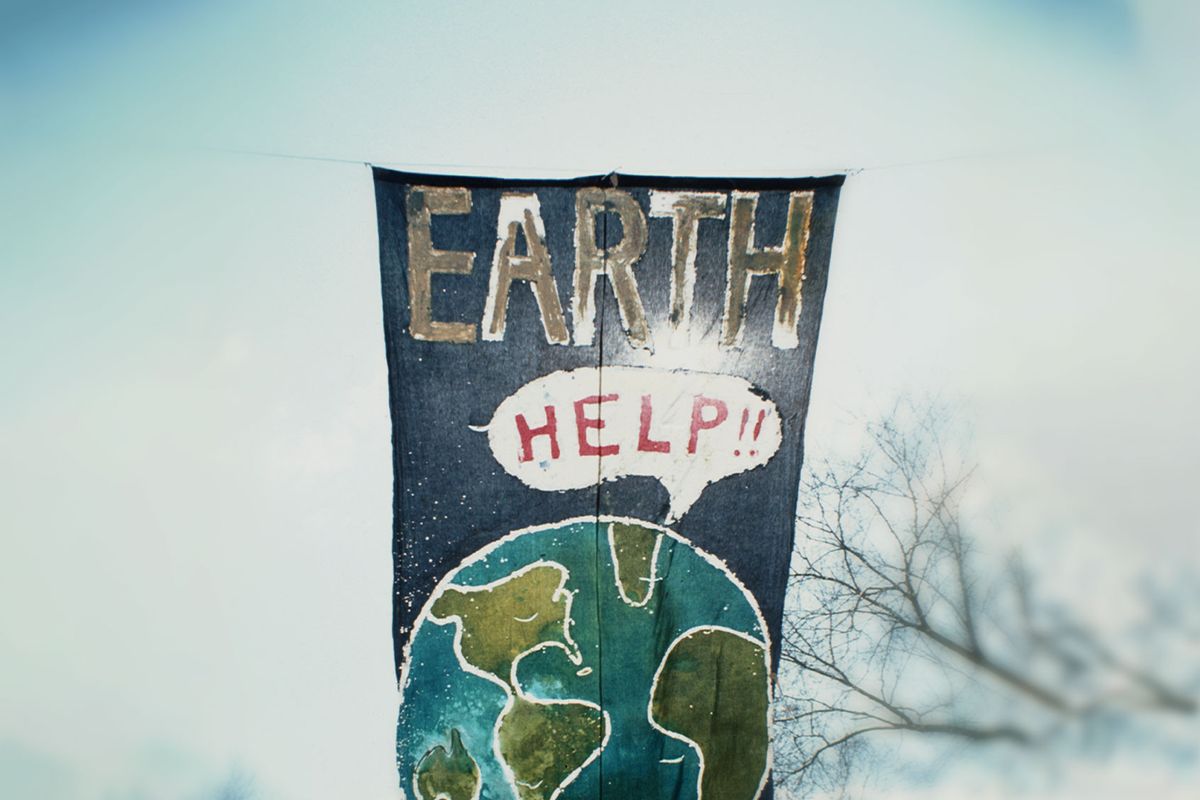 A banner at the inaugural Earth Day depicting the earth calling out for help, New York City, 22nd April 1970. (Archive Photos/Getty Images)