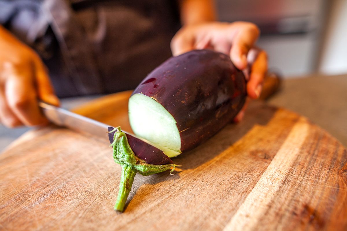 Eggplant on a cutting board (Capelle.r / Getty Images)