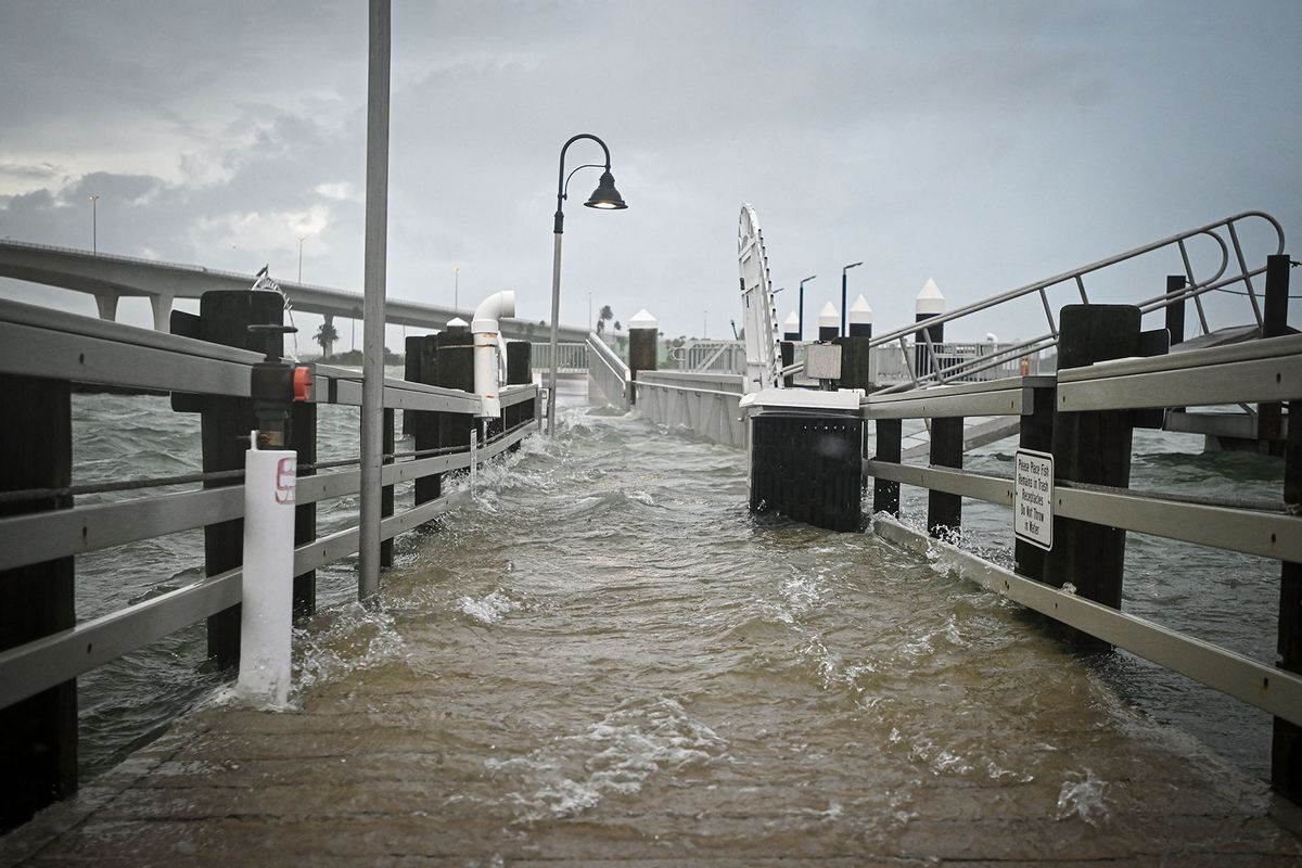 A boardwalk at the Clearwater Harbor Marina in Clearwater, Florida, is flooded by the rising tide on August 30, 2023, after Hurricane Idalia made landfall. (MIGUEL J. RODRIGUEZ CARRILLO/AFP via Getty Images)