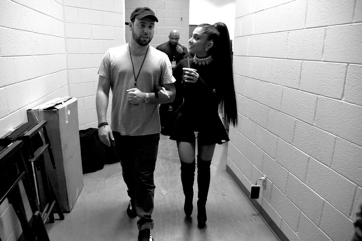 Scooter Braun (L) and Ariana Grande walk backstage during the "Dangerous Woman" Tour Opener at Talking Stick Resort Arena on February 3, 2017 in Phoenix, Arizona. (Kevin Mazur/Getty Images for Live Nation)