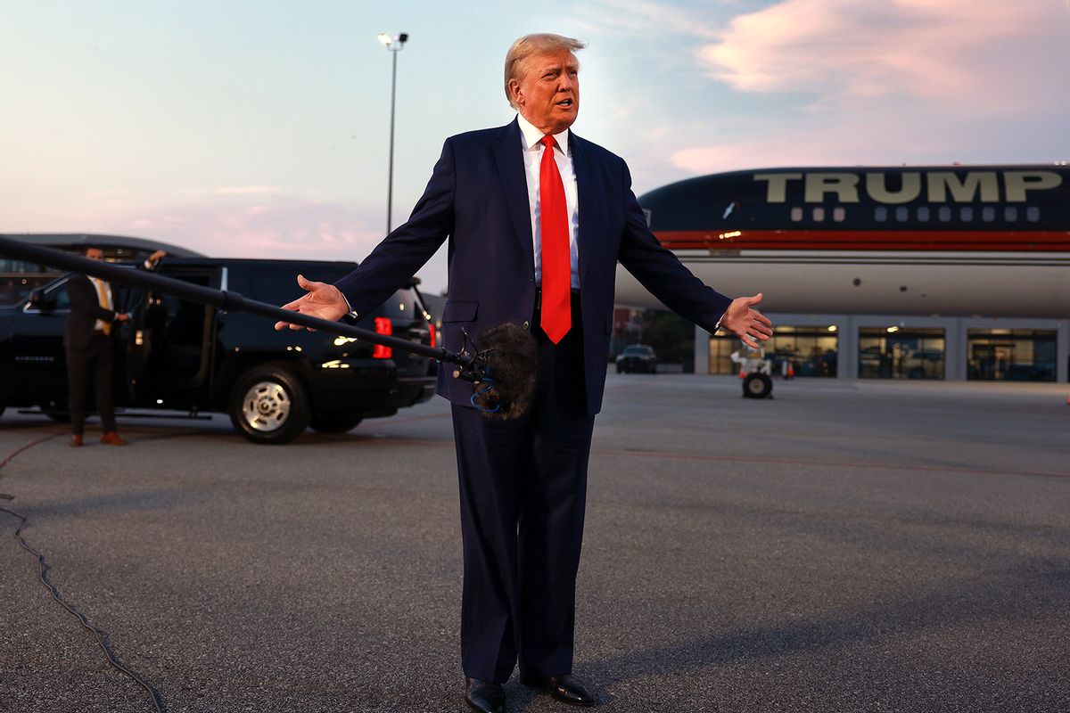Former U.S. President Donald Trump speaks to the media at Atlanta Hartsfield-Jackson International Airport after surrendering at the Fulton County jail on August 24, 2023 in Atlanta, Georgia. (Photo by Joe Raedle/Getty Images)