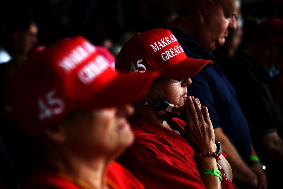 Trump supporters pray as they await the arrival of President Donald Trump at Latrobe Airport on September 3, 2020 in Latrobe, Pennsylvania. (Jeff Swensen/Getty Images)