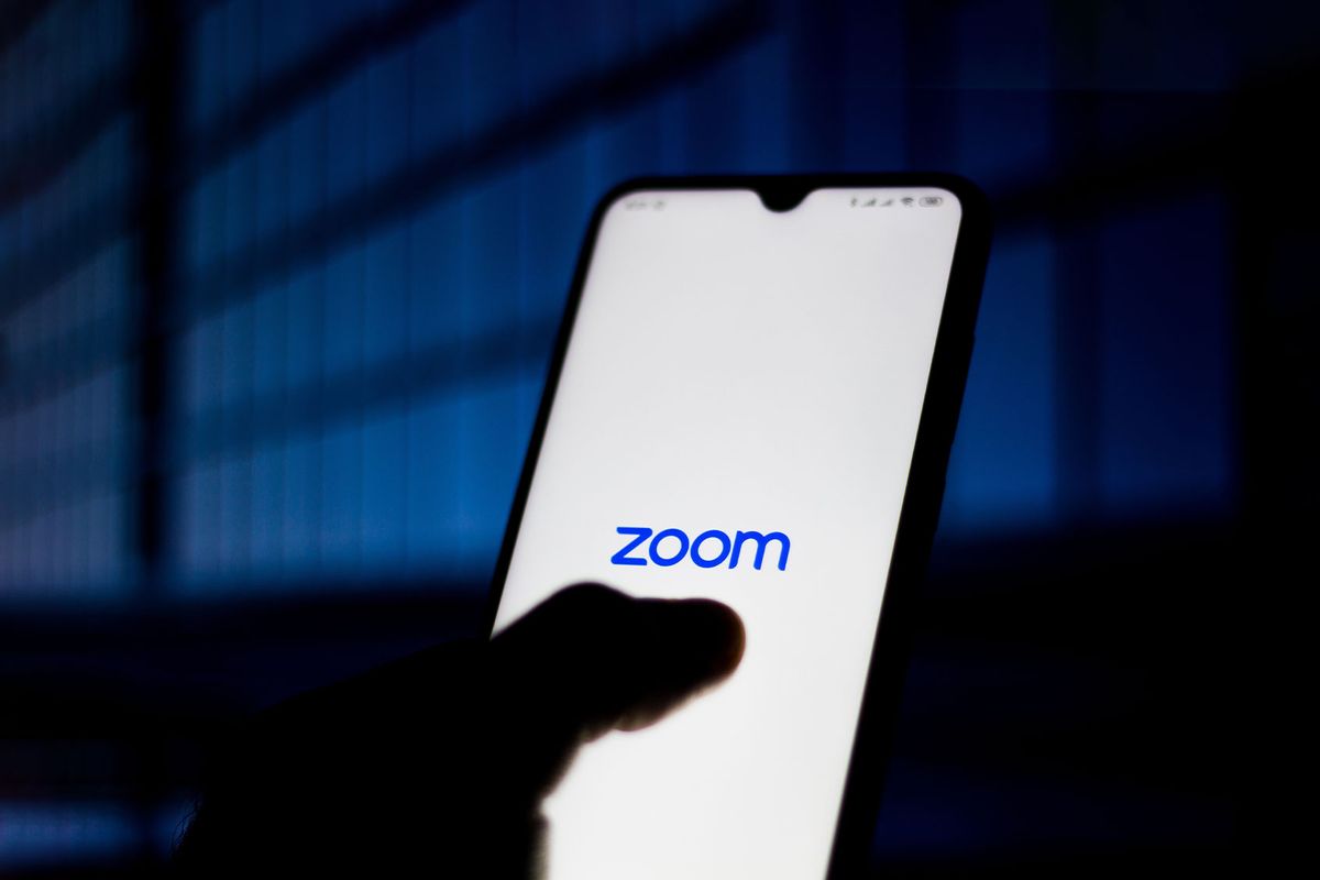 Zoom Meetings logo is seen displayed on a smartphone. (Photo Illustration by Rafael Henrique/SOPA Images/LightRocket via Getty Images)