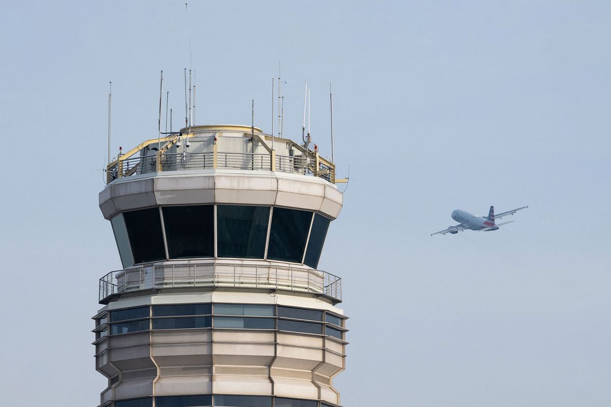 An American Airlines Airbus A319 airplane takes off past the air traffic control tower at Ronald Reagan Washington National Airport in Arlington, Virginia, January 11, 2023. (SAUL LOEB/AFP via Getty Images)
