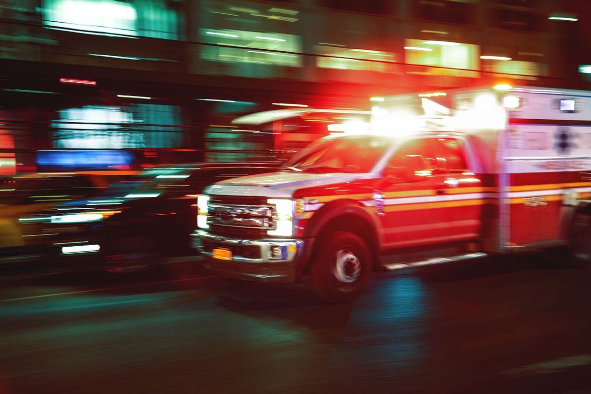 Rushing ambulance at night, US (Getty Images/Marco_Piunti)