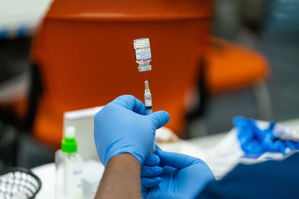 A healthcare employee prepares a syringe with the Moderna COVID-19 vaccine. (Eric Lee for The Washington Post via Getty Images)