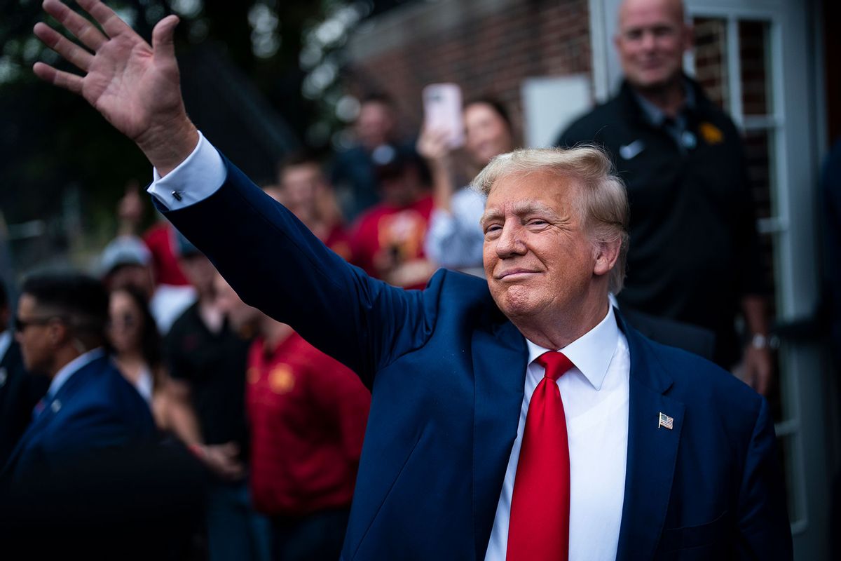 Former President Donald Trump greets others while visiting the Alpha Gamma Rho fraternity before a NCAA college football game between Iowa State University and the University of Iowa at Jack Trice Stadium on Saturday, Sept 09, 2023, in Ames, Iowa. (Jabin Botsford/The Washington Post via Getty Images)