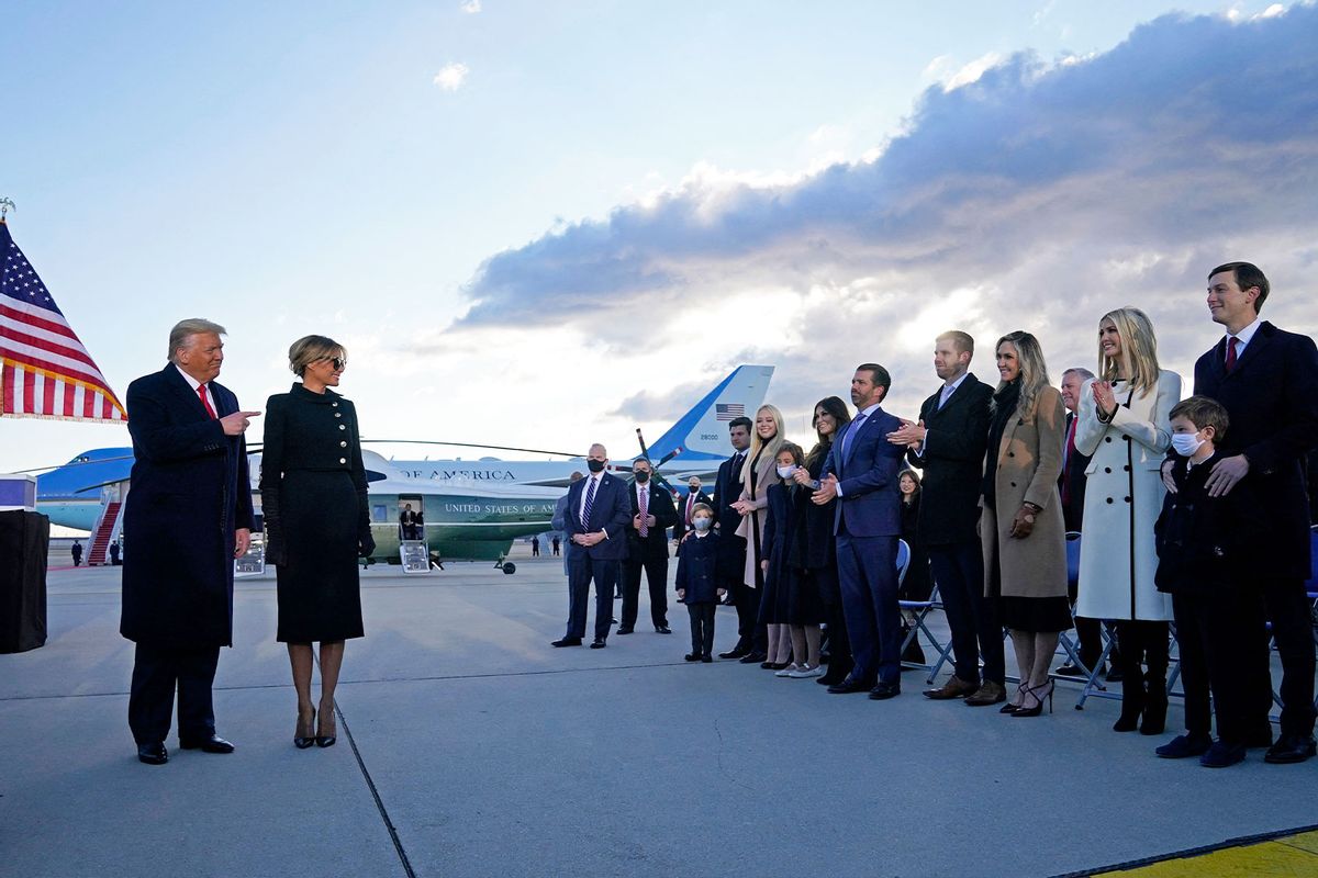 Donald Trump and First Lady Melania are greeted by Ivanka Trump (2nd R), husband Jared Kushner (R), their children, Eric (C-R) and Donald Jr. (C-L), Tiffany Trump and other Trump family members on the tarmac at Joint Base Andrews in Maryland on January 20, 2021. (ALEX EDELMAN/AFP via Getty Images)