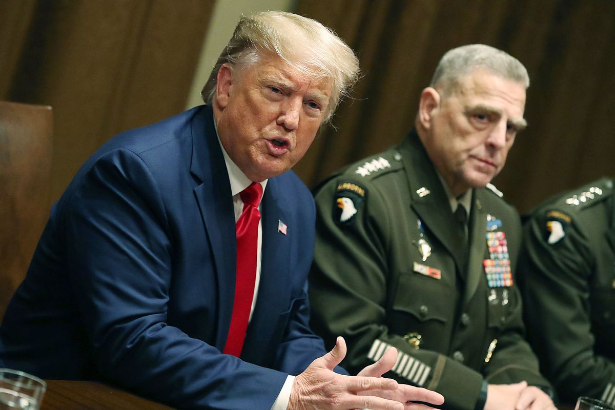 U.S. President Donald Trump speaks as Joint Chiefs of Staff Chairman, Army General Mark Milley looks on after a briefing from senior military leaders in the Cabinet Room at the White House on October 7, 2019 in Washington, DC. (Mark Wilson/Getty Images)