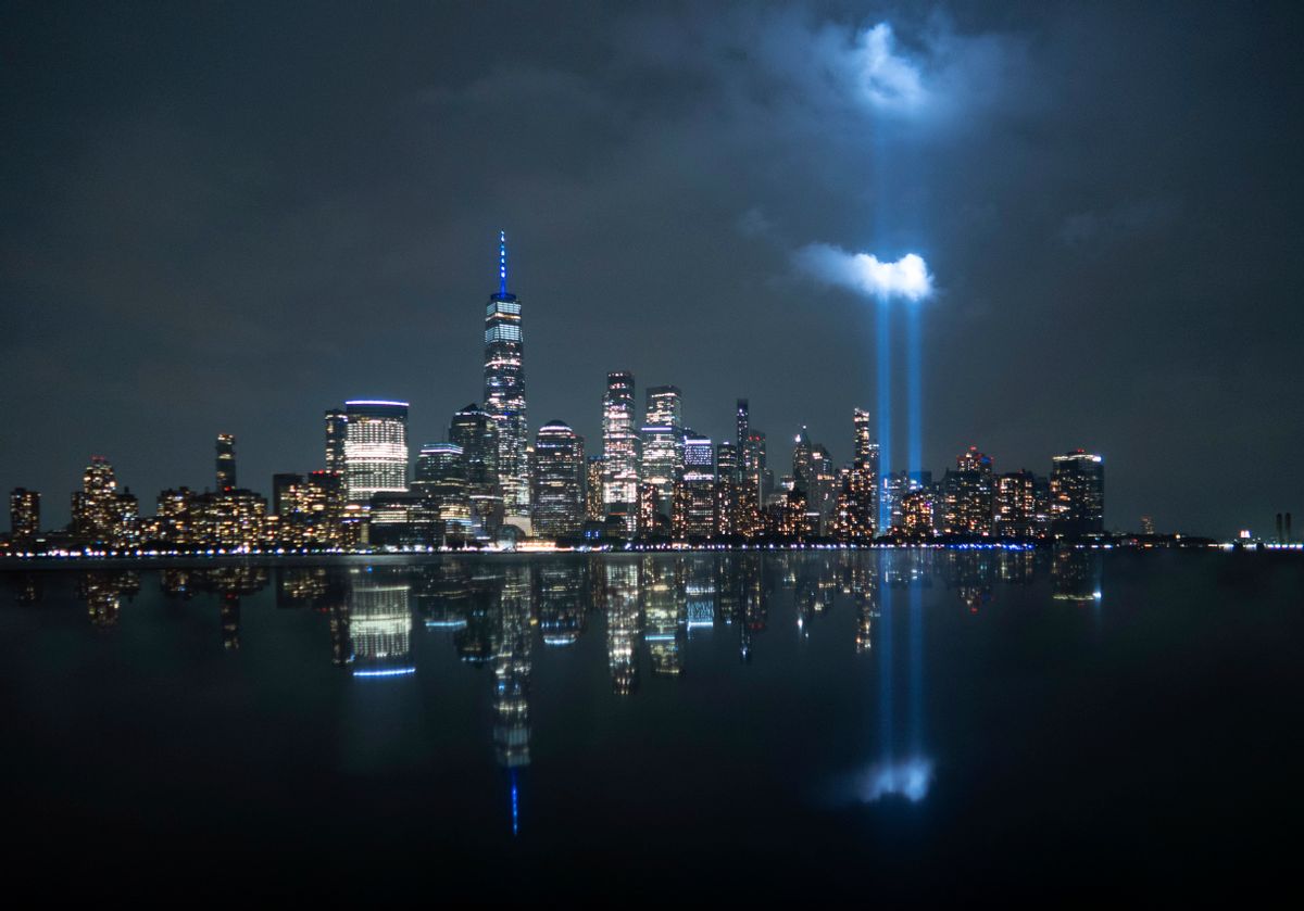 The annual Tribute in Light is illuminated above the skyline of lower Manhattan and One World Trade Center and the Statue of Liberty, Sept. 10, 2023. (Gary Hershorn/Getty Images)