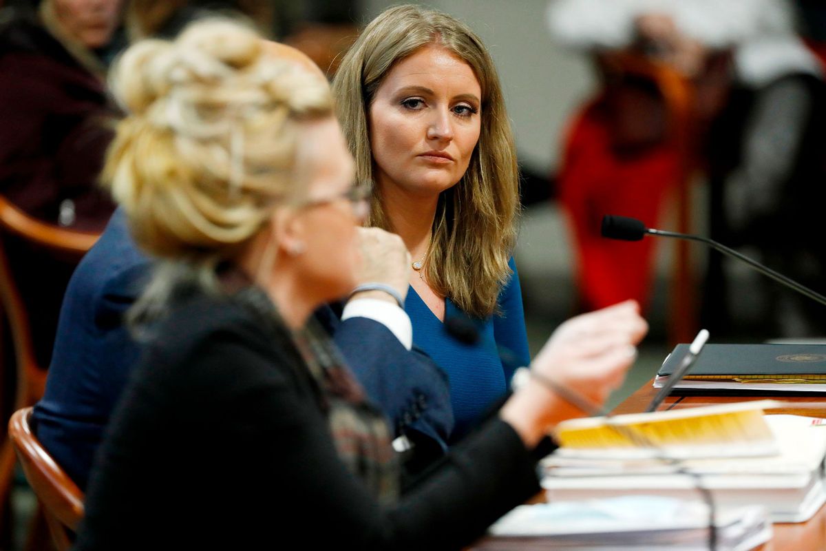 Lawyer Jenna Ellis (R) listens to Melissa Carone, who was working for Dominion Voting Services, as she speaks in front of the Michigan House Oversight Committee in Lansing, Michigan on December 2, 2020. (JEFF KOWALSKY/AFP via Getty Images)