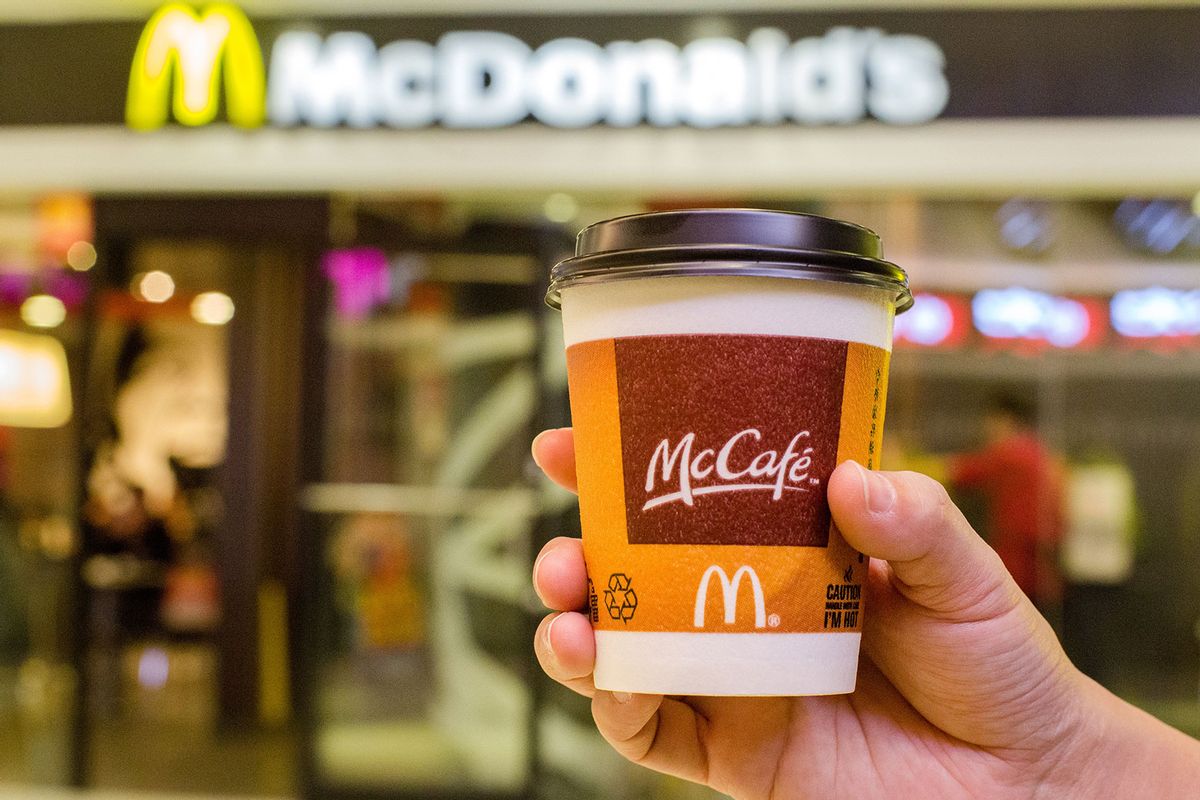 A customer holds a cup of Coffee served by McCafe out of a McDonald's restaurant. ( Zhang Peng/LightRocket via Getty Images)