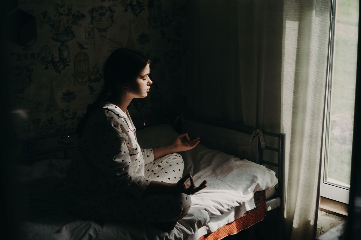 Teenage Girl Meditating in Her Room (Getty Images/Fiordaliso)