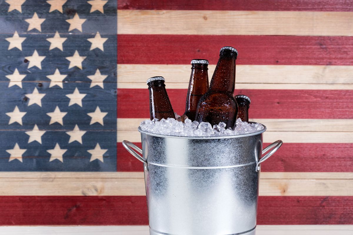 Bucket of ice cold beer with USA flag in background (Getty Images/tab1962)