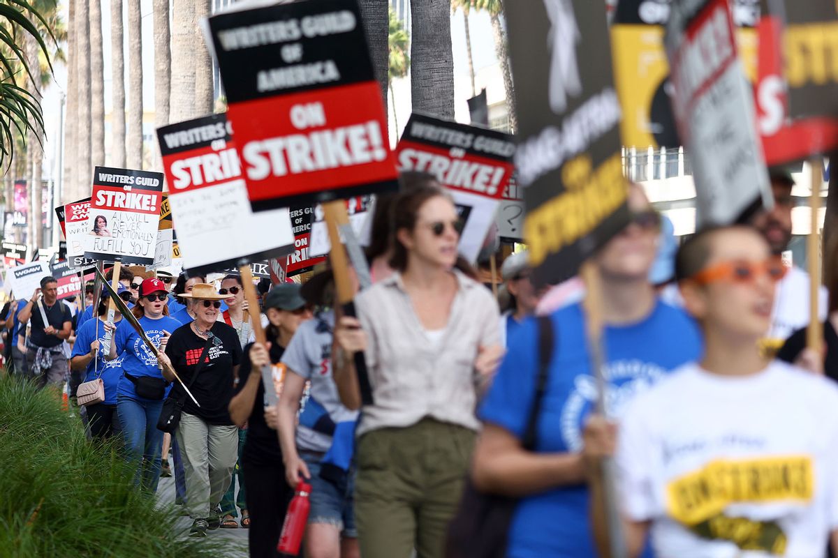 Striking WGA (Writers Guild of America) members picket with striking SAG-AFTRA members outside Netflix studios on September 22, 2023 in Los Angeles, California. (Mario Tama/Getty Images)