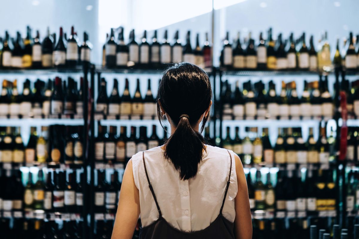 Woman shopping for wine (Getty Images/d3sign)
