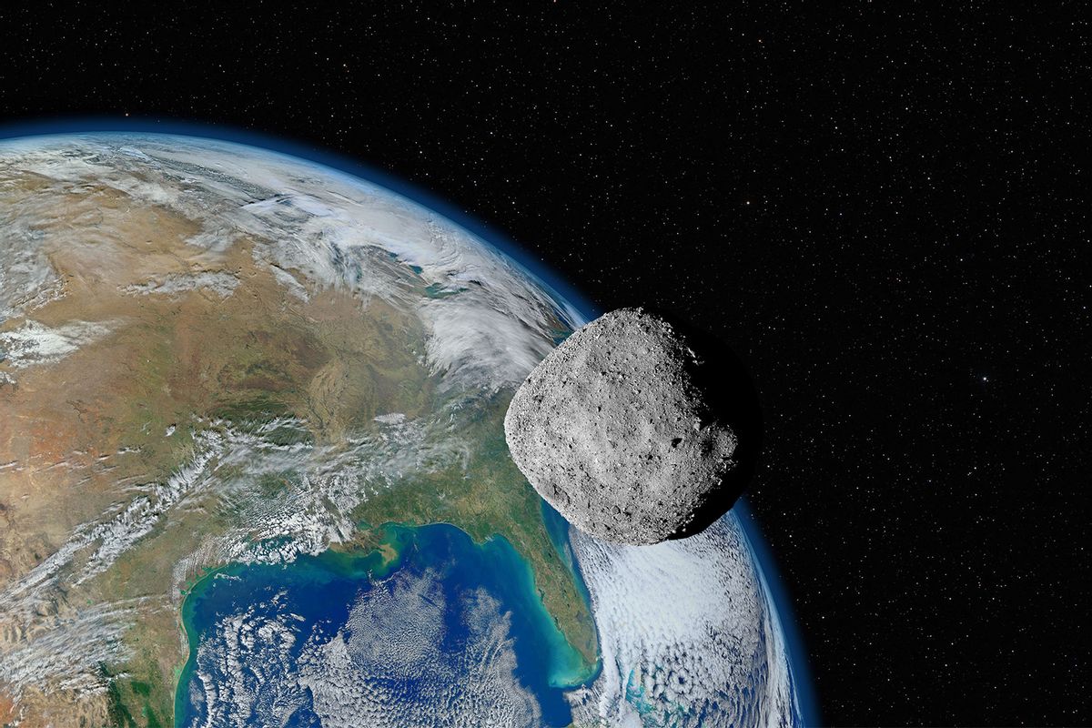 Asteroid approaching planet Earth (Getty Images/dzika_mrowka)