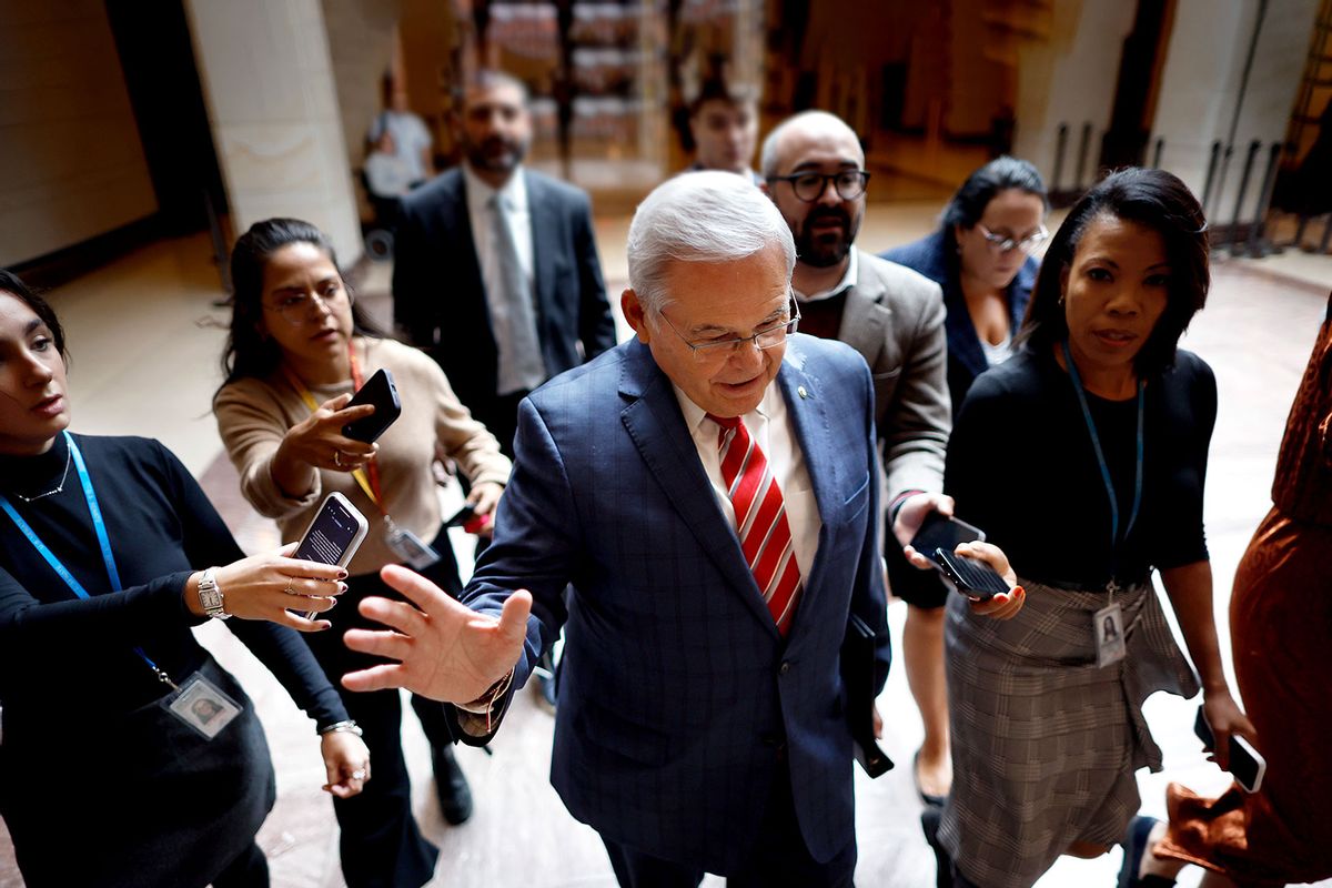 Sen. Bob Menendez (D-NJ) (C) waves away journalists after addressing a closed Democratic caucus meeting at the U.S. Capitol on September 28, 2023 in Washington, DC. (Chip Somodevilla/Getty Images)