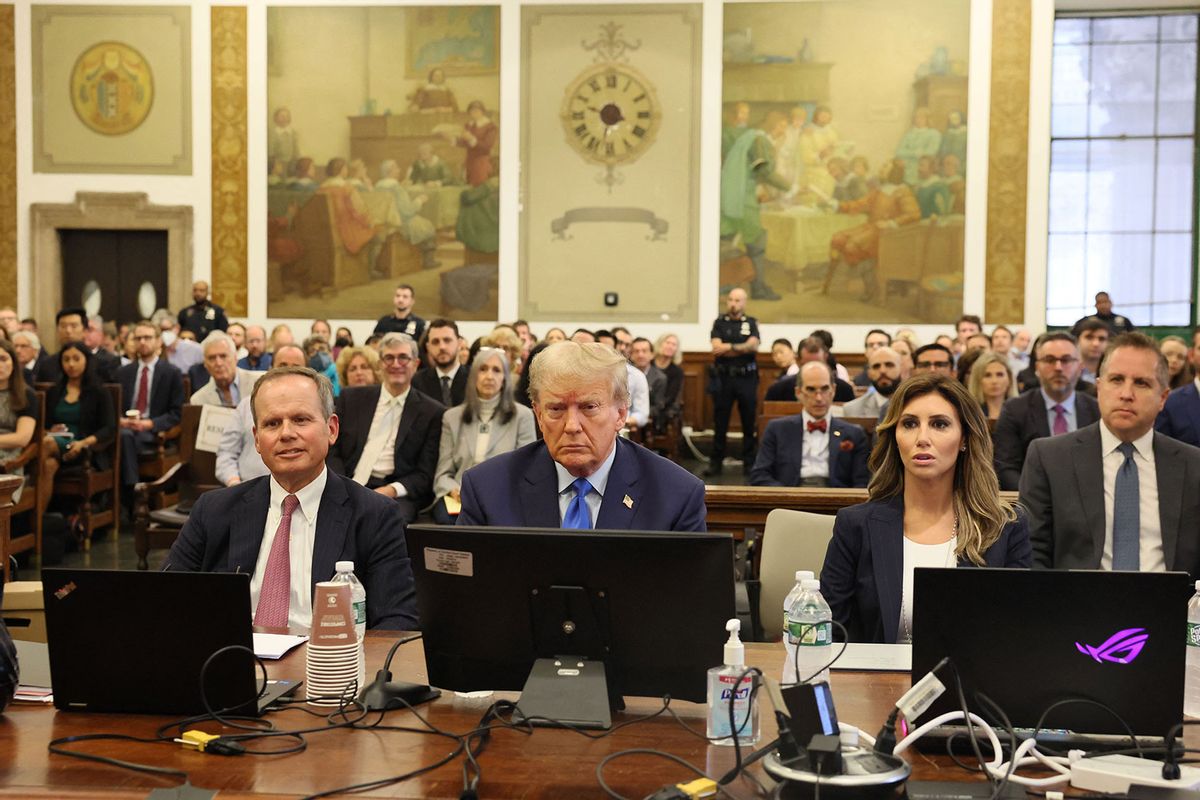 Former US President Donald Trump (C) sits with his attorneys inside the courtroom during his civil fraud case brought by state Attorney General Letitia James, at a Manhattan courthouse, in New York City, on October 2, 2023. (BRENDAN MCDERMID/POOL/AFP via Getty Images)