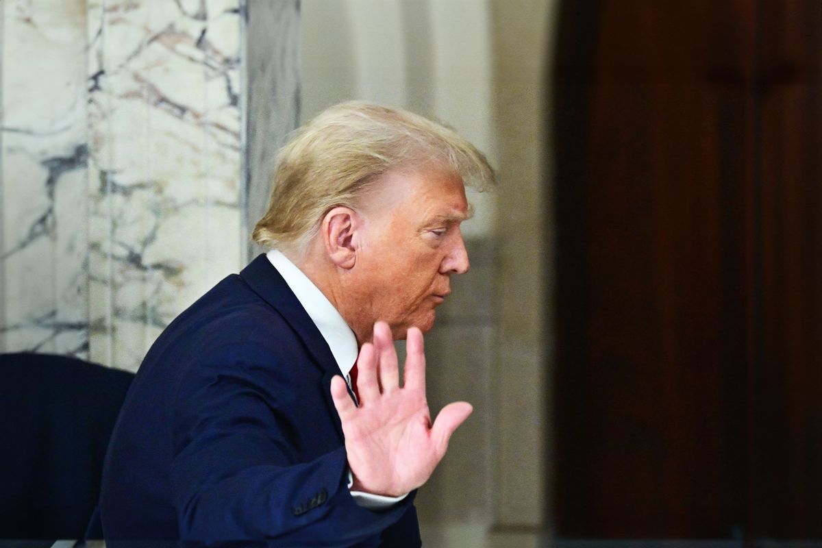 Former US President Donald Trump waves after speaking to the media during the third day of his civil fraud trial in New York on October 4, 2023. (ANGELA WEISS/AFP via Getty Images)