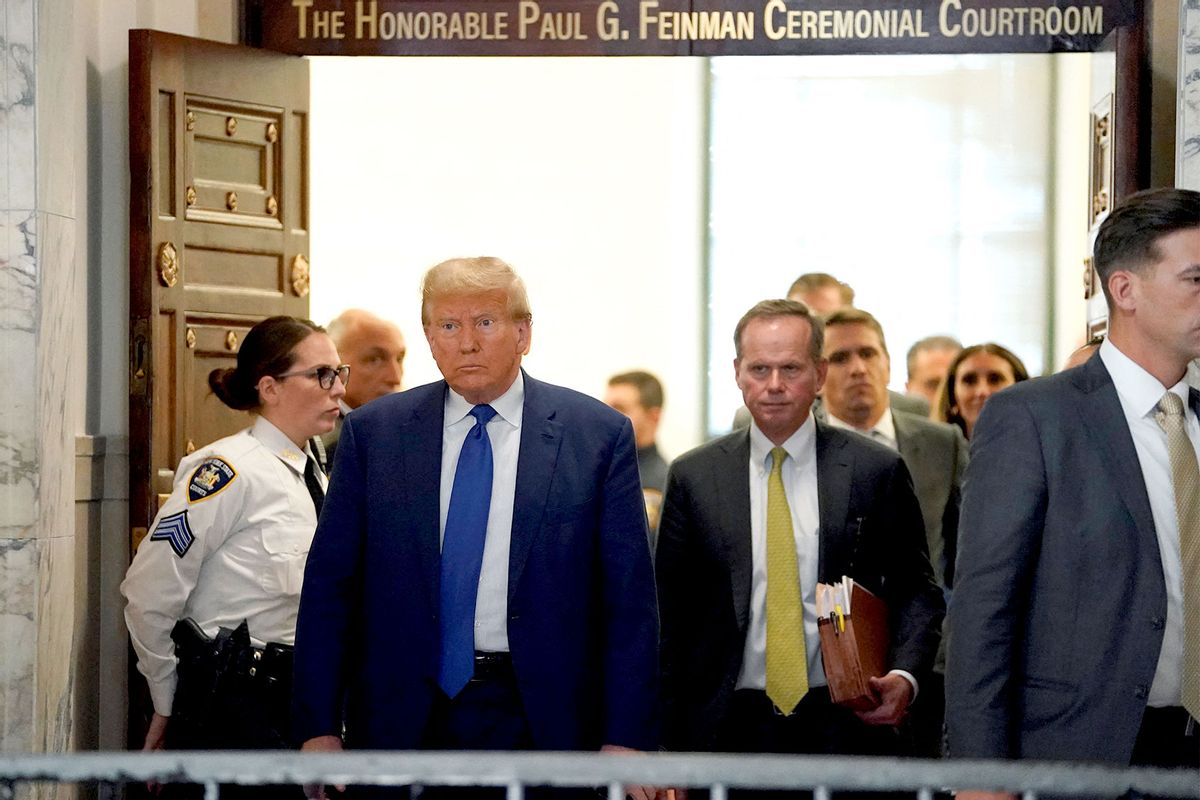 Former US president Donald Trump walks during a break at court in New York at his $250 million civil fraud trial against him and his company on October 25, 2023. (TIMOTHY A. CLARY/AFP via Getty Images)