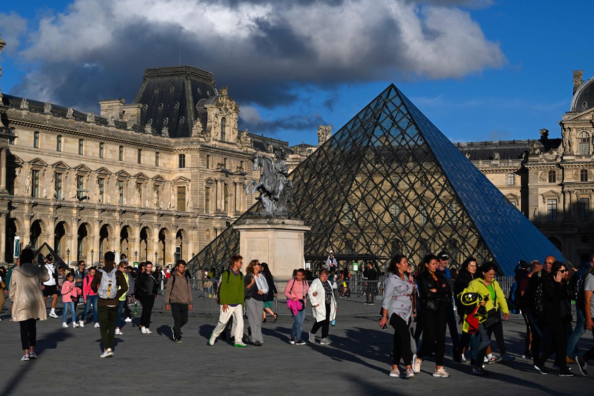 Tourists outside the Louvre Museum, Paris. (Miguel Medina/AFP via Getty Images)