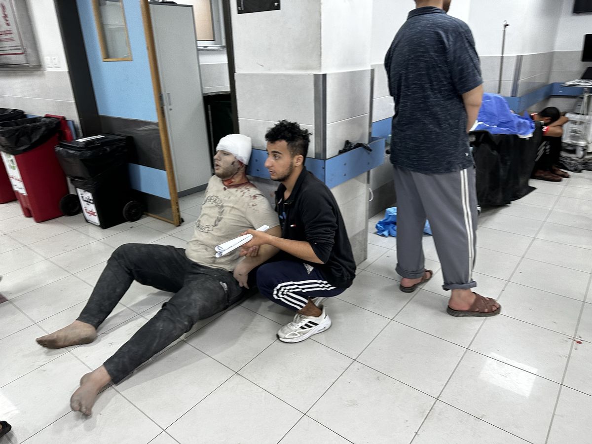 Palestinians injured due to Israeli airstrikes are brought to Al-Shifa Hospital in Gaza on Oct. 14, 2023. (Ali Jadallah/Anadolu via Getty Images)