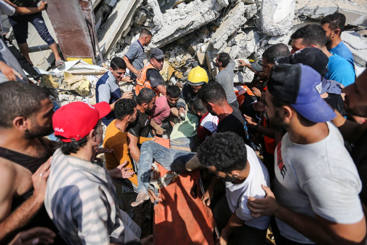 Palestinian emergency services and local citizens search for victims in buildings destroyed during Israeli air raids in Khan Yunis, Gaza, Oct. 24, 2023. (Ahmad Hasaballah/Getty Images)