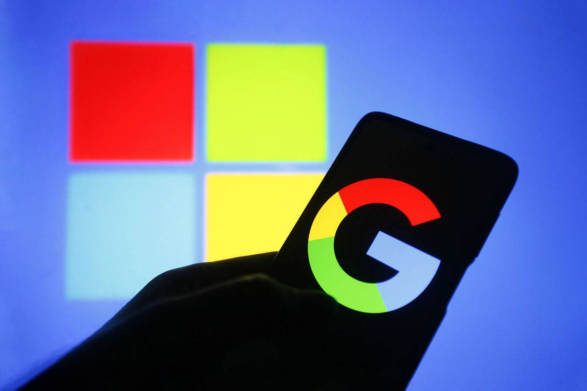 In this photo illustration, a Google logo is seen on a smartphone with a Microsoft logo in the background. (Photo Illustration by Pavlo Gonchar/SOPA Images/LightRocket via Getty Images)