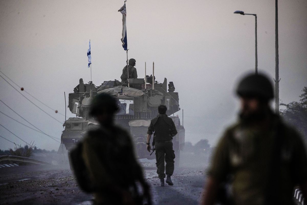 Israeli tanks move near Gaza border as Israeli army deploys military vehicles around the Gaza Strip, Israel on October 12, 2023. (Mostafa Alkharouf/Anadolu via Getty Images)