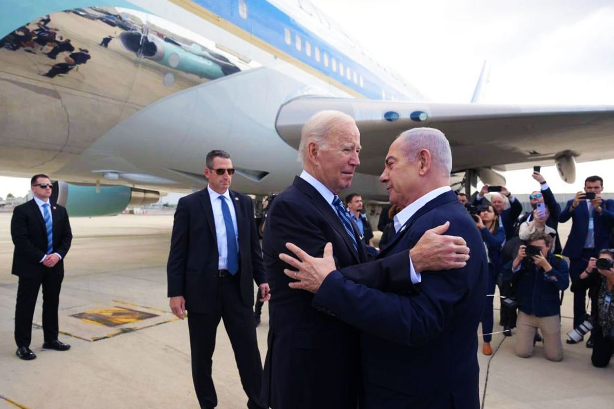 US President Joe Biden is welcomed by Prime Minister Benjamin Netanyahu (R) at the Ben Gurion Airport in Tel Aviv, Israel on October 18, 2023. (GPO/ Handout/Anadolu via Getty Images)