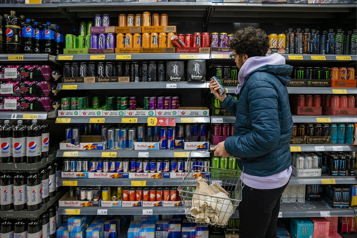 Man Shopping For Energy Drinks (Getty Images/SolStock)