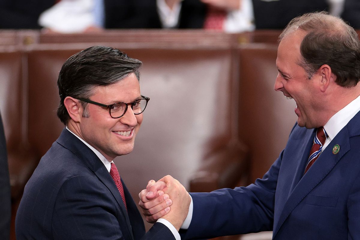 U.S. Rep. Mike Johnson (R-LA) (L) shakes hands with Rep. Andy Barr (R-KY) as the House of Representatives holds an election for a new Speaker of the House at the U.S. Capitol on October 25, 2023 in Washington, DC. (Win McNamee/Getty Images)