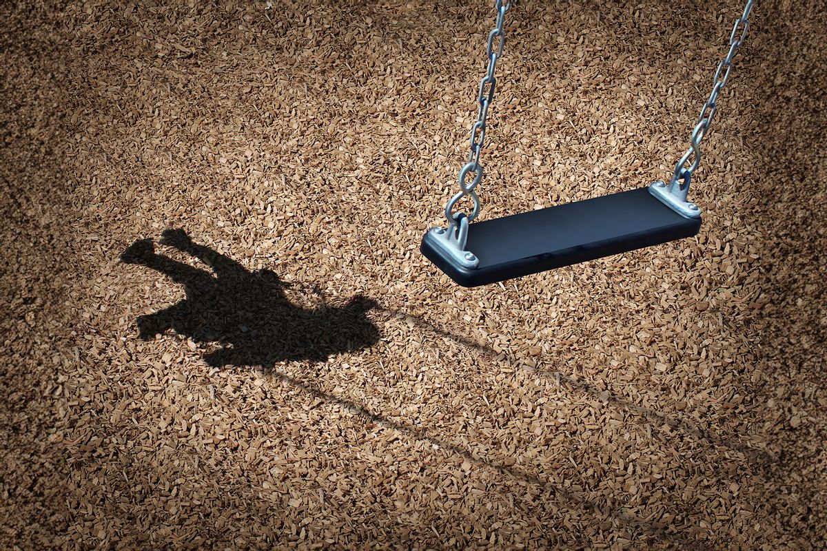 Missing child concept with an empty playground swing and the shadow of a little girl on the park ground (Getty Images/wildpixel)