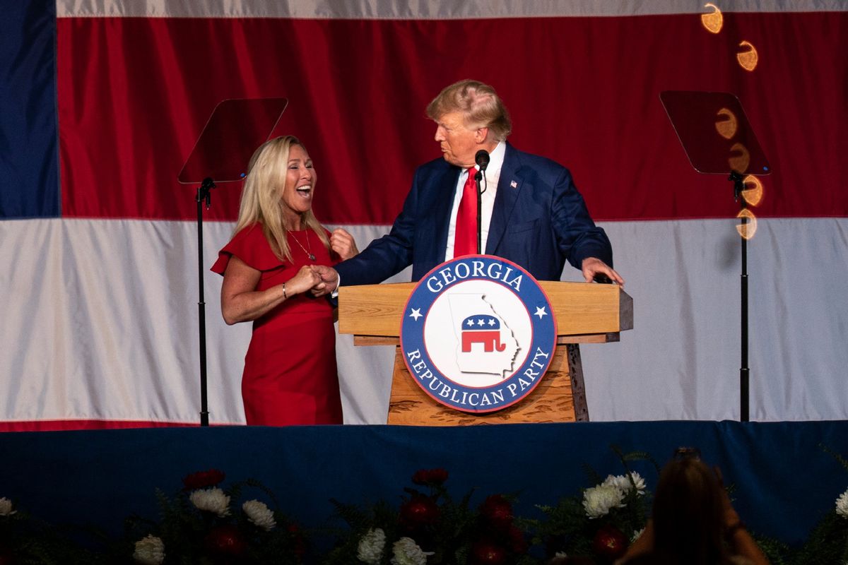 Former U.S. President and Republican presidential candidate Donald Trump greets U.S. Representative Marjorie Taylor Greene at the Georgia Republican Party's state convention on Saturday, June 10, 2023 in Columbus, GA. (Cheney Orr for The Washington Post via Getty Images)