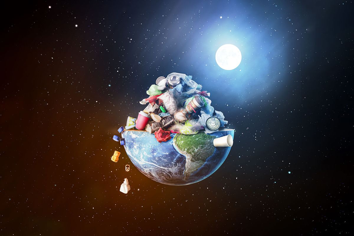 Planet Earth with a pile of garbage spilling into outer space (Getty Images/urfinguss)
