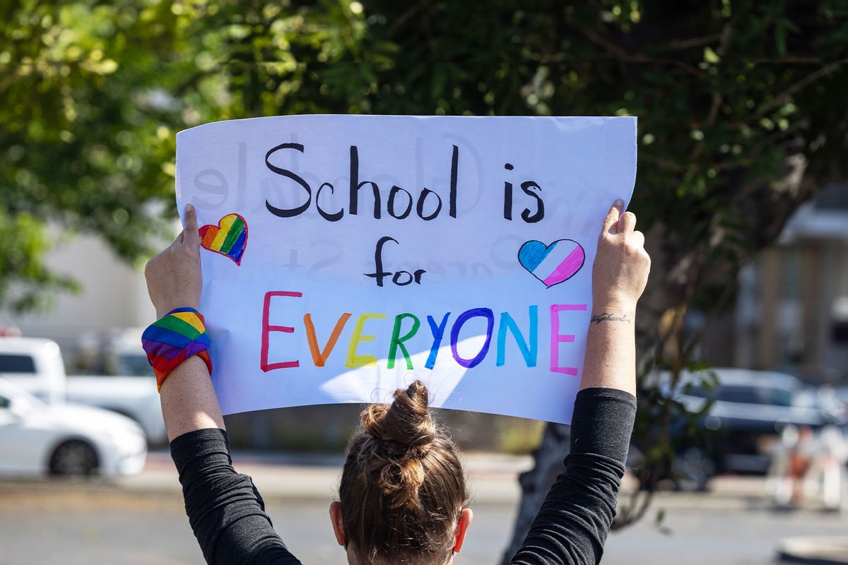 A pro-LGBTQ+ demonstrator holds a sign outside a Glendale Unified School District (GUSD) Board of Education meeting on June 20, 2023 in Glendale, California. (David McNew/Getty Images)
