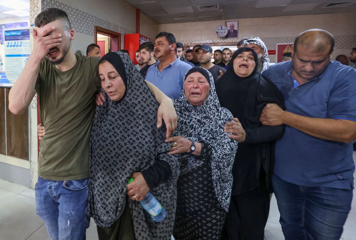 Palestinians mourn a relative who reportedly died following his injury in clashes with Israeli settlers in Qusra village, in Rafidia hospital in Nablus city in the occupied West Bank, on October 11, 2023. (ZAIN JAAFAR/AFP via Getty Images)