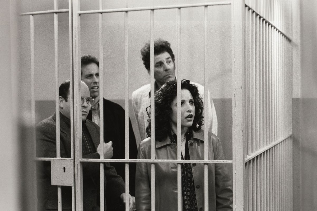 Actors Jason Alexander (George), Jerry Seinfeld (Jerry), Michael Richards (Kramer), and Julia Louis-Dreyfus (Elaine) stand behind bars in a scene during the last days of filming the final episode of Seinfeld in Studio City, California, April 3, 1998. (David Hume Kennerly/Getty Images)