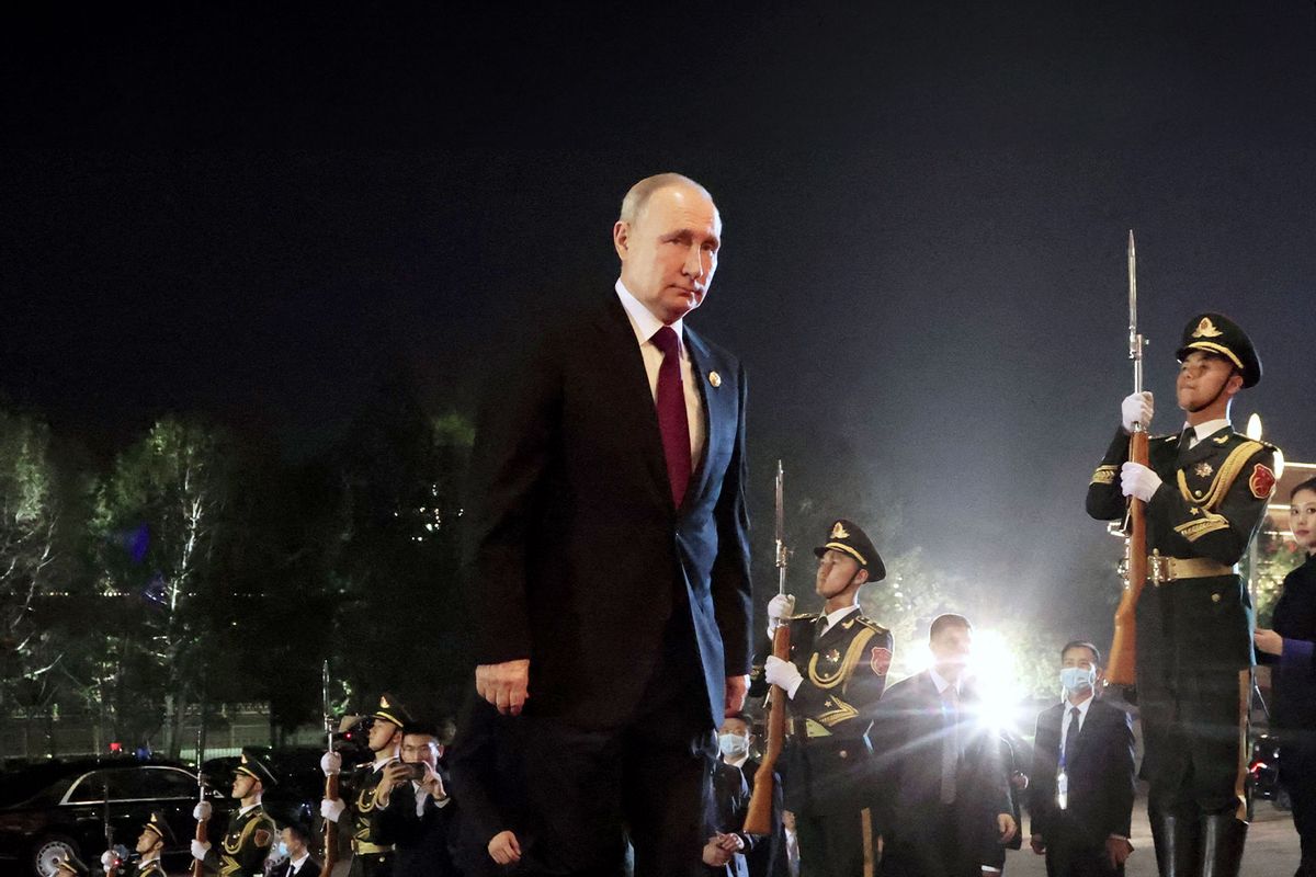 This pool photograph distributed by Russian state owned agency Sputnik shows Russia's President Vladimir Putin arriving for a welcoming ceremony for heads of delegations participating in the Third Belt and Road Forum, hosted by Chinese President and his wife, in Beijing on October 17, 2023. (KONSTANTIN ZAVRAZHIN/POOL/AFP via Getty Images)