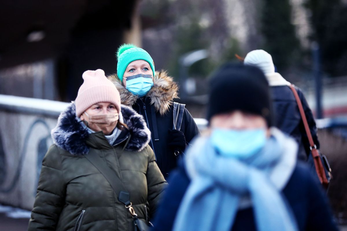 People are wearing face masks during the fifth wave of the coronavirus pandemic in Krakow, Poland. January 18, 2022. (Beata Zawrzel/NurPhoto via Getty Images)