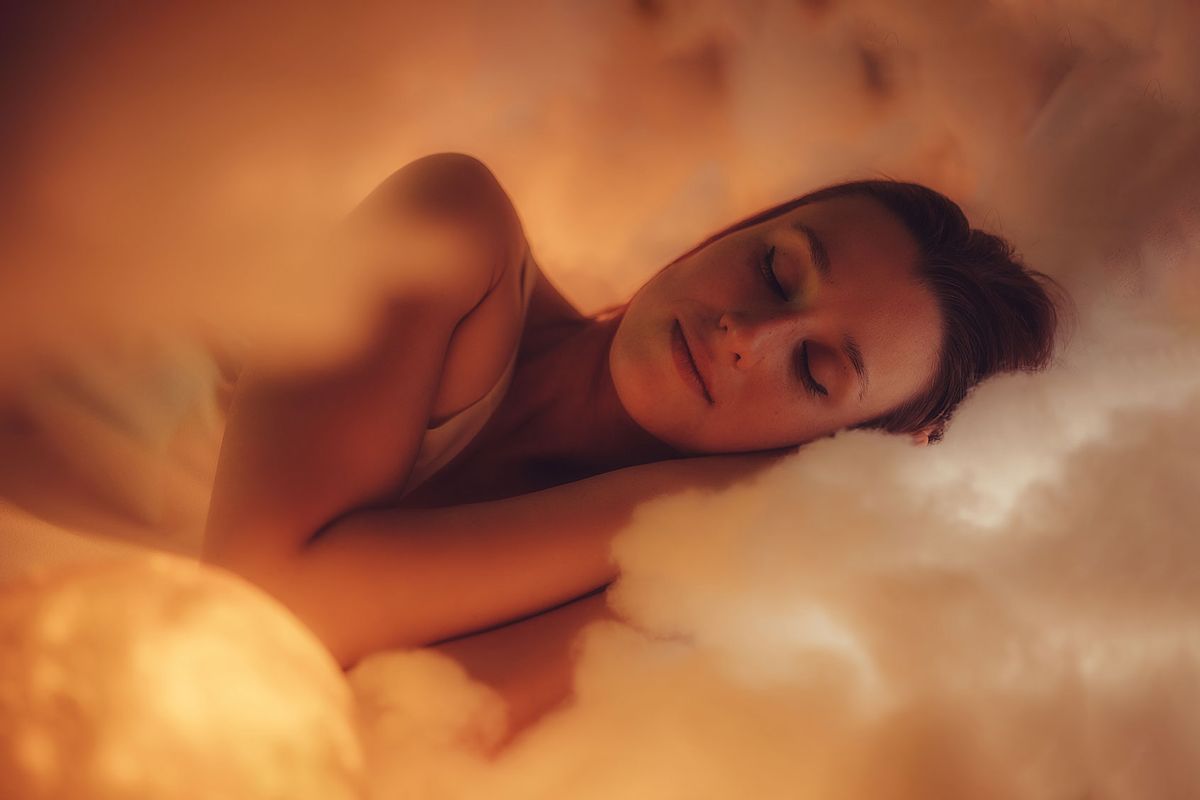 Woman sleeping peaceful on cloud (Getty Images/urbazon)